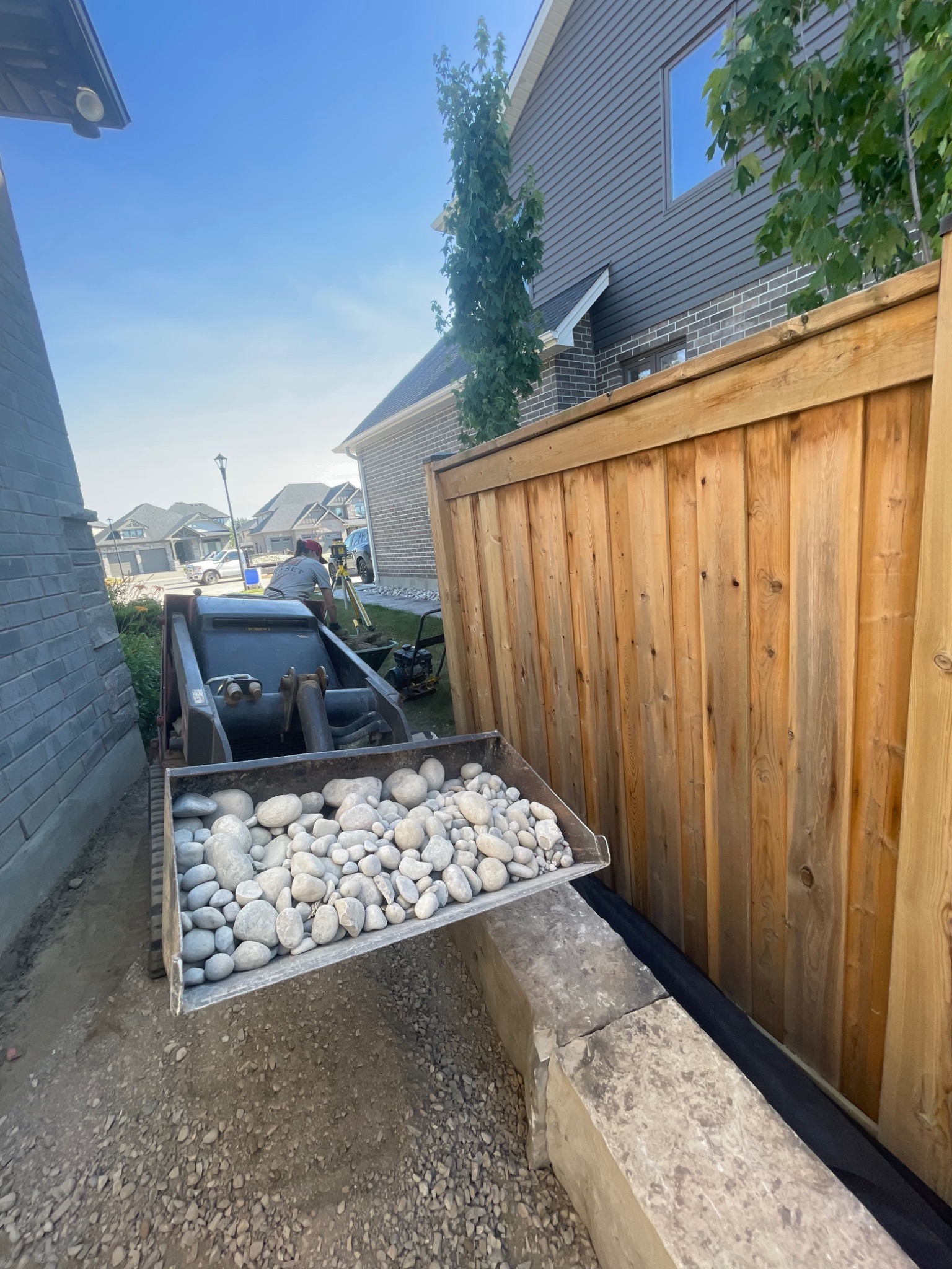 Hardscape site preparation using compact equipment and stone material
